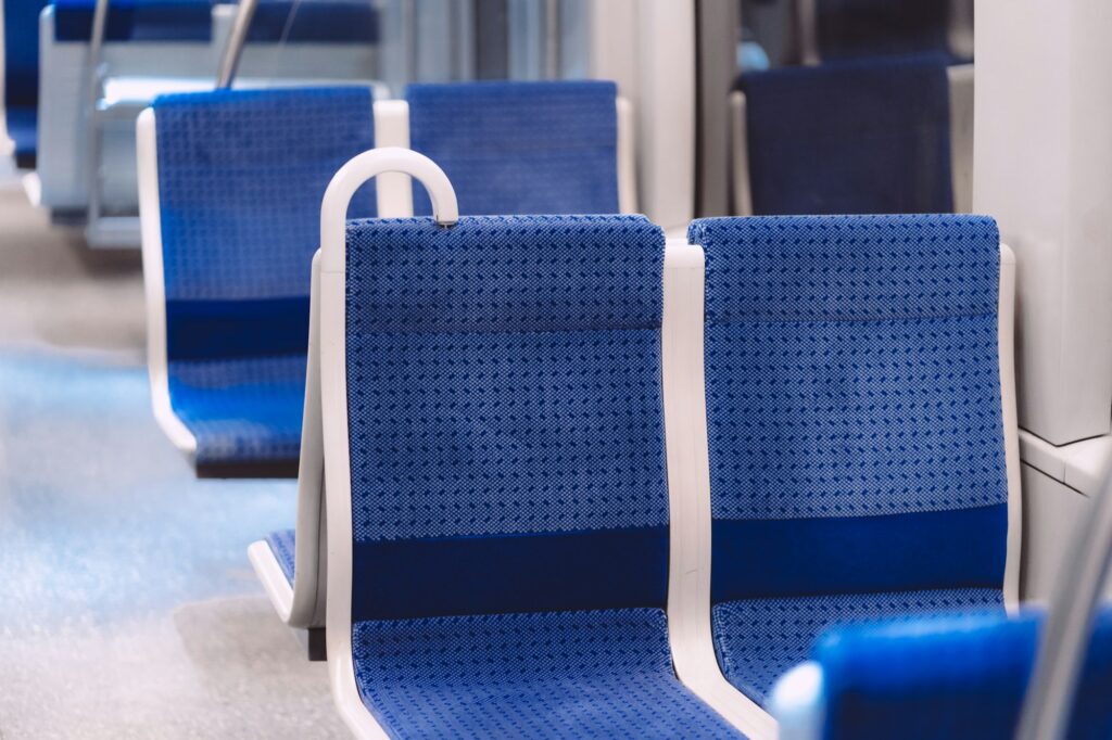 Blue seats in the bus during daytime in Munich, Germany